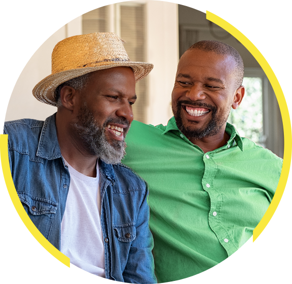 Photo of two men laughing together